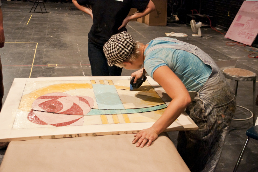 Participants working on window projects